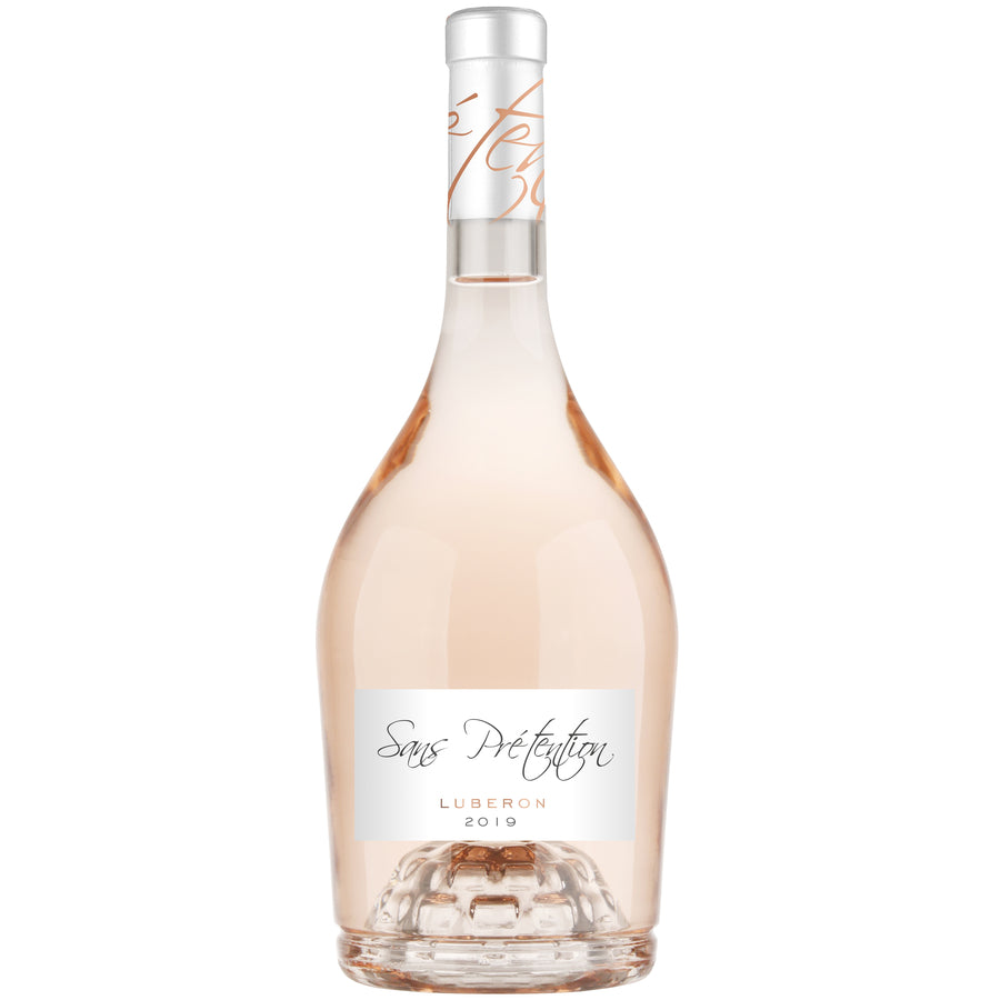 Rose wine bottle with a white label on a white background