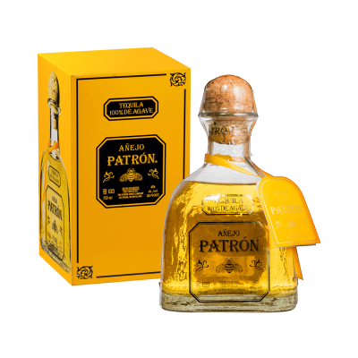 Patron tequila bottle with wooden cap and yellow box on a white background
