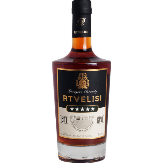 Bottle of Rtvelisi brandy on a white background