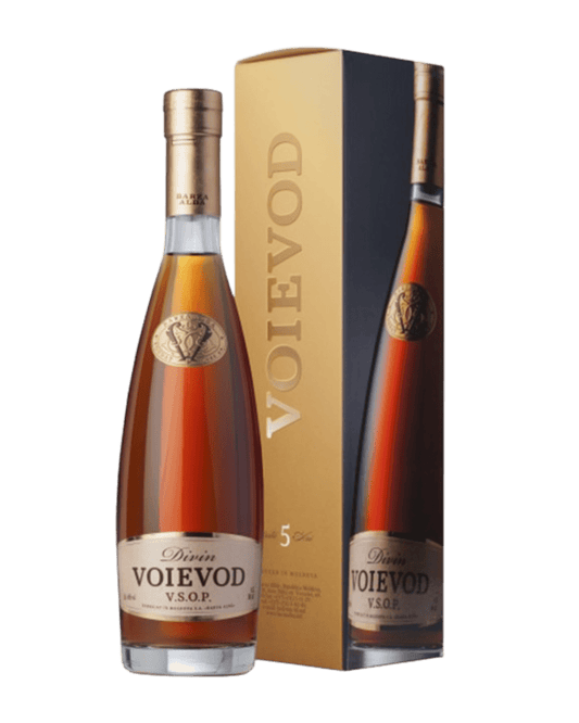 Bottle and packaging of Voievod VSOP cognac on a green background